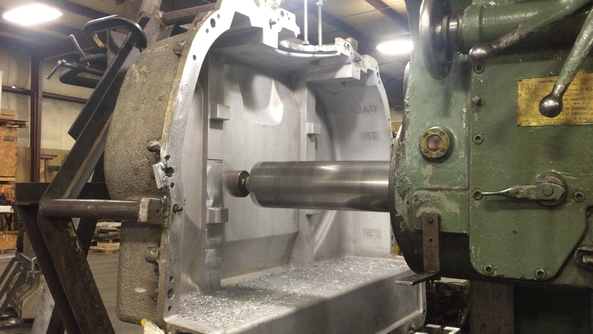 Horizontal boring mill machining a large metal casting